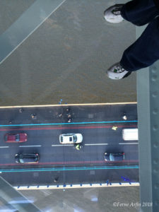 Standing on the glass floor of the Tower Bridge Walkway