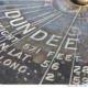 Picture of Dundee orientation table on The Law #dundee #scotland #uk #directions #orientation #graffic #latitide #longitude, bronze #weathered