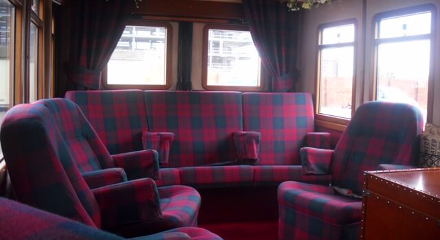 Interior of vintage bus upholstered tartan seats