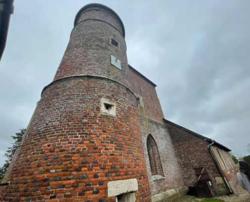 Round tower of fortified church made of brick