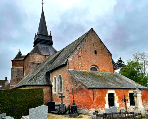 Fortified church from rear showing graves and fortified steeple,