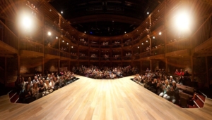view of the thrust stage at the Swan Theater, showing the thrust stage and the audience