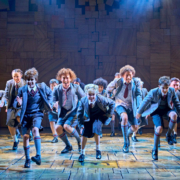Children dancing in School Uniforms in Matilda The Musical.