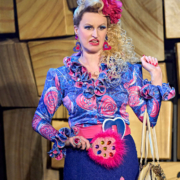 Mathilda's Mum in the RSC Production of Mathilda the Musical looks and acts like a Panto character